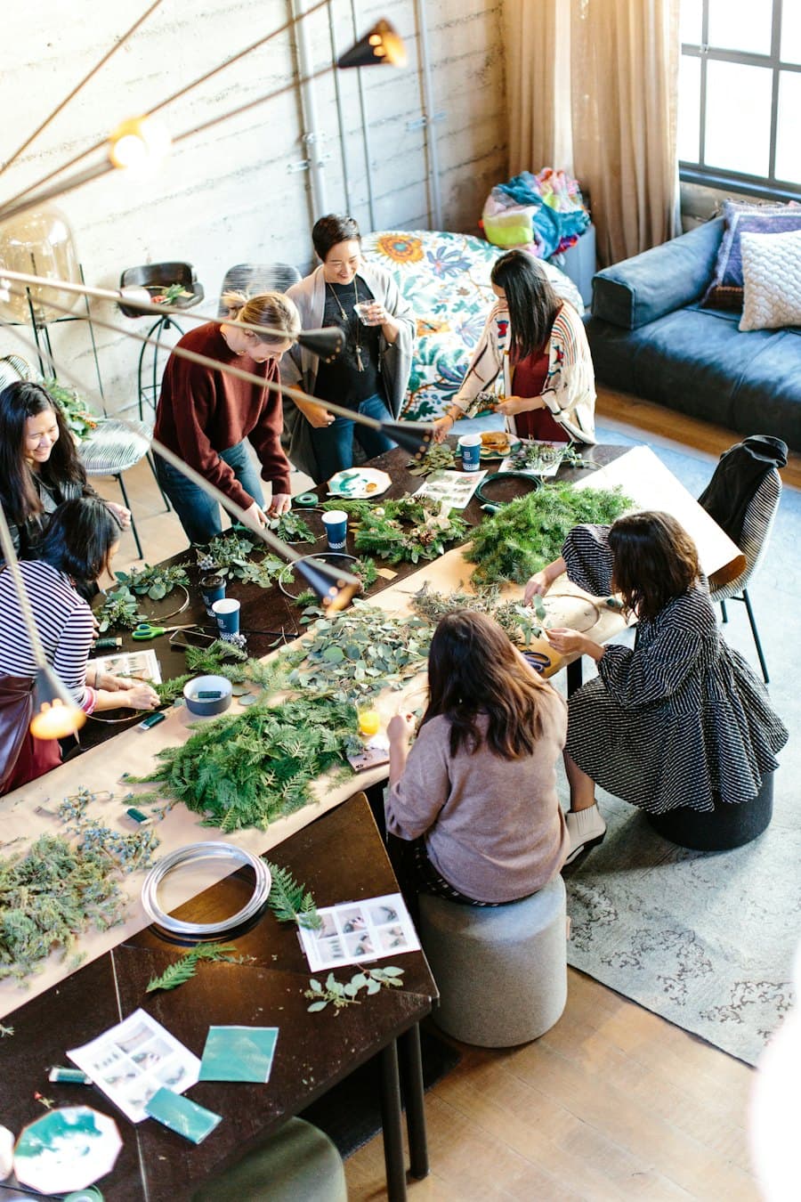 People working together at a table in a community workshop