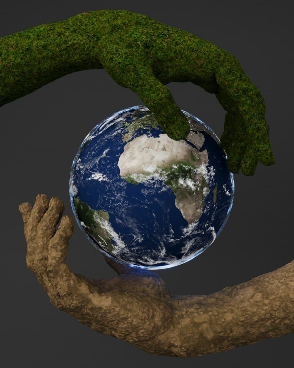 Two hands holding a small model of the earth