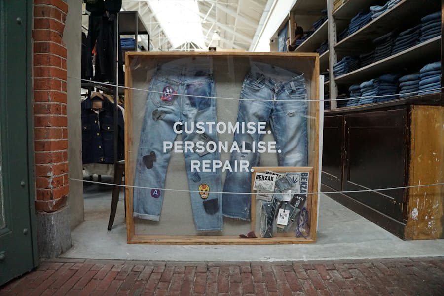Worn jeans laid out with repair and customisation options
